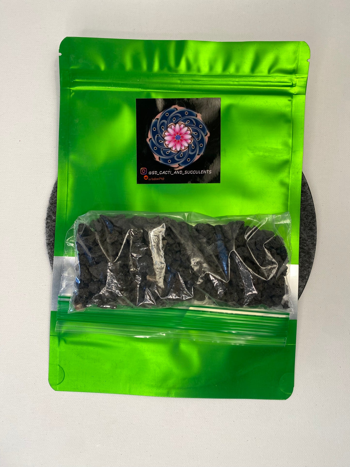 Black lava stone top dressing.